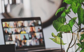 A picture of a laptop with meeting foreign friends online